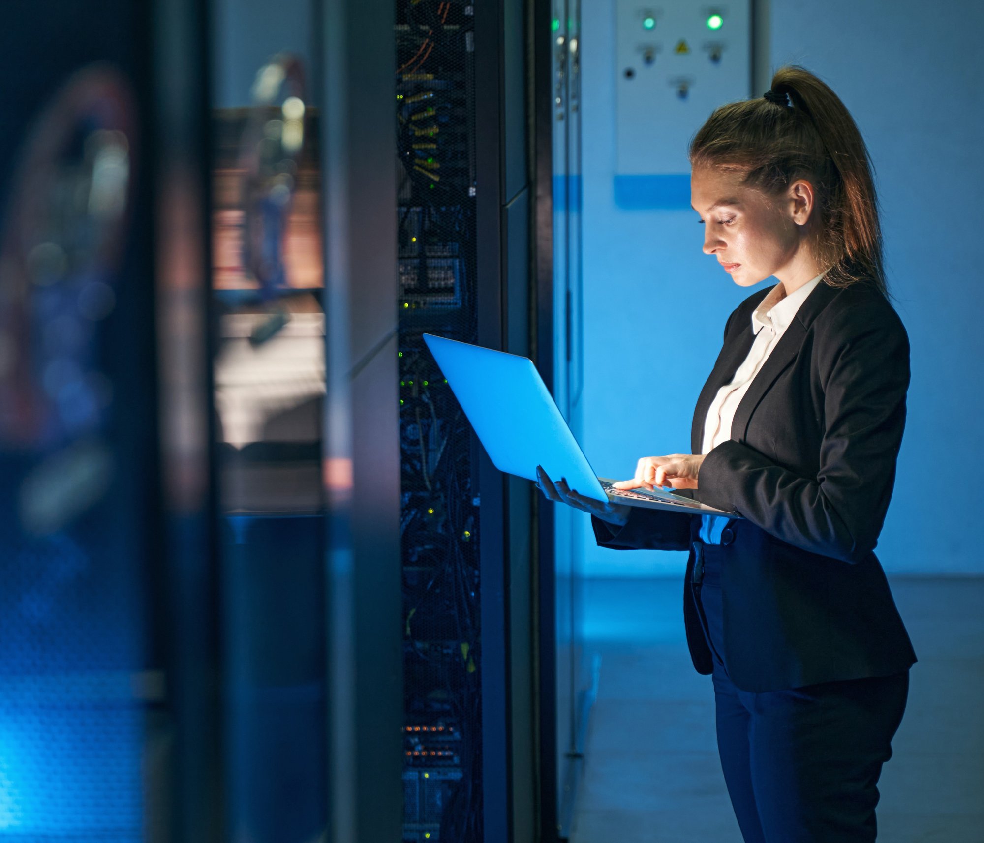 cybersecurity professional at server rack