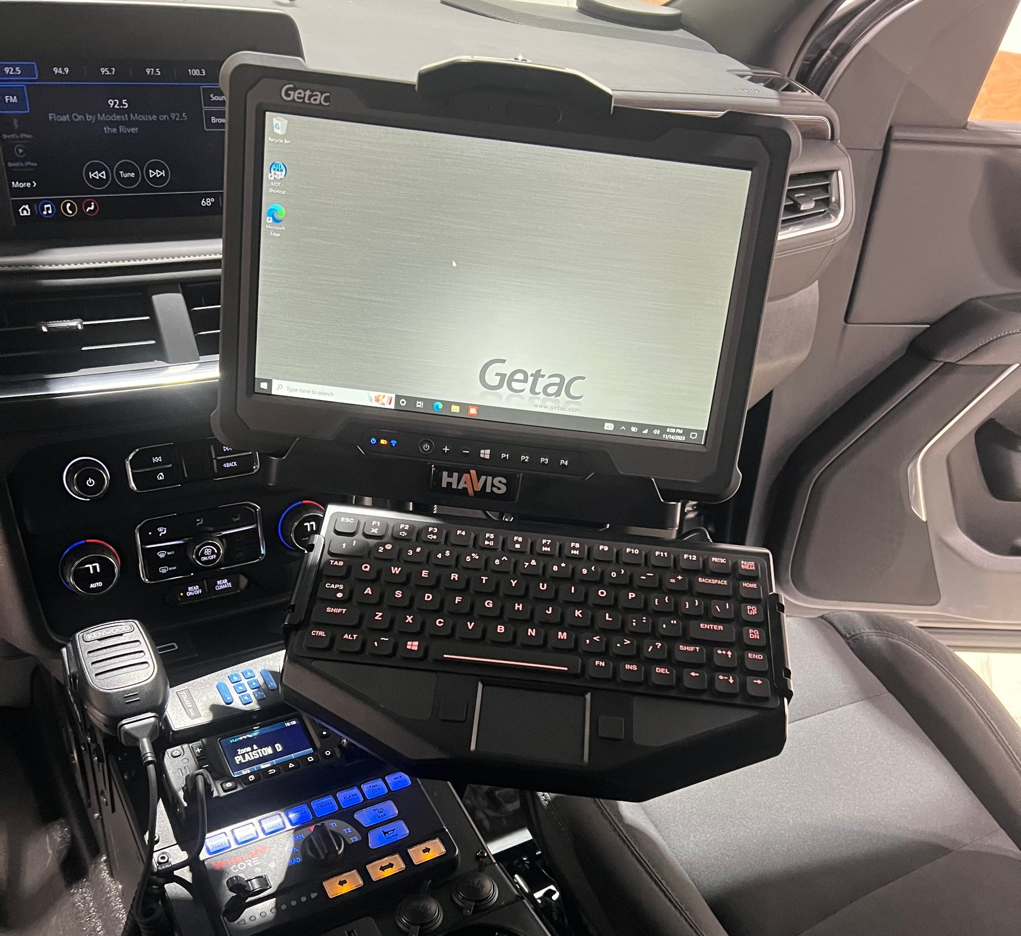 laptop in console area of police vehicle