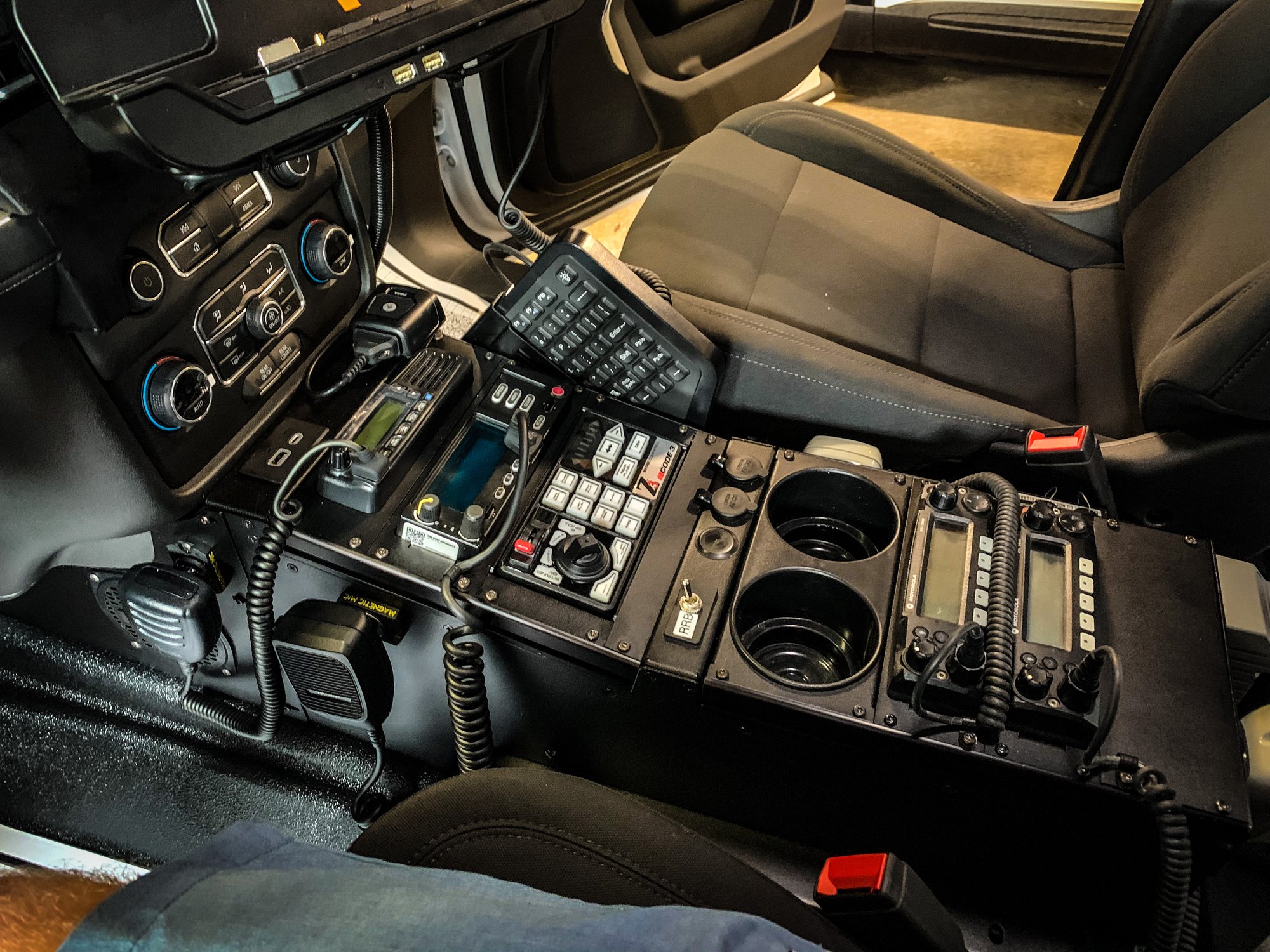 police cruiser console with many radio systems