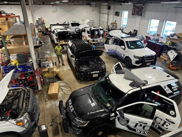 shop interior with many police vehicles