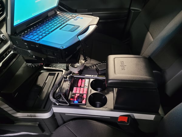 laptop and electronics in police vehicle console